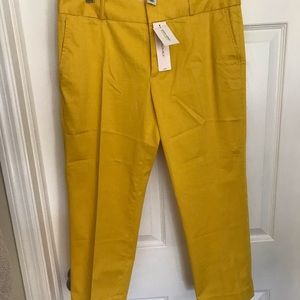 Yellow cropped pants.